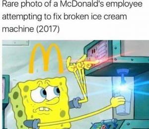 Rare photo of a McDonald's employee attempting to fix broken ice cream machine (2017)