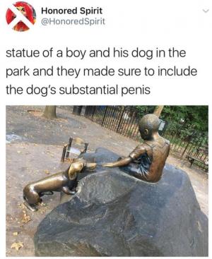 Statue of a boy and his dog in the park and they made sure to include the dog's substantial penis