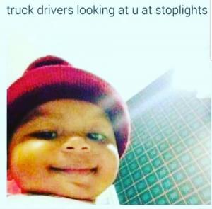 Truck driver looking at u at stoplights
