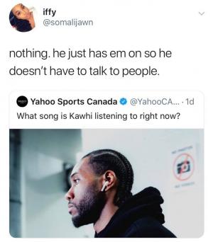 Nothing. he just has em on so he doesn't have to talk to people.

What song is Kawhi listening to right now?